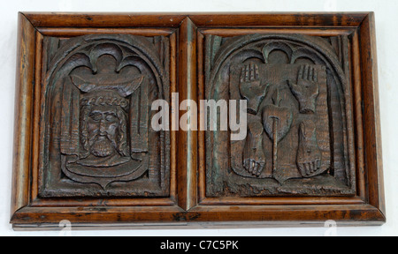Carvings on chestnut wood in the church of St Sampson, Golant, Cornwall. SEE DESCRIPTION FOR DETAILS. Stock Photo
