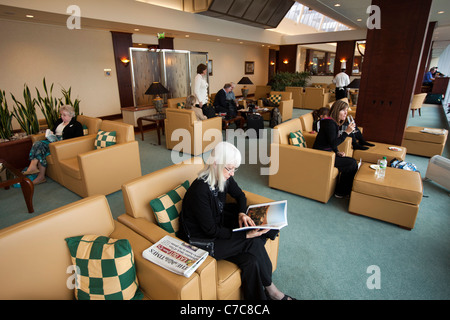 UK, Manchester Airport, passengers waiting in Emirates Airlines Business Class Lounge Stock Photo