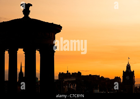 Sunset on Dugald Stewart monument and Edinburgh Castle, viewed from Calton Hill Scotland UK, Europe Stock Photo