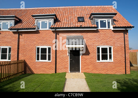 Newly built houses on a mixed development in the village of Bawdsey, Suffolk, UK. Stock Photo