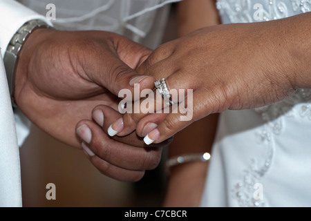 Church African American wedding ceremony couple groom with bride showing off their hands with wedding rings in USA US horizontal hi-res Stock Photo