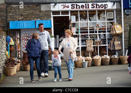 Family outside The Shell Shop in Padstow, Cornwall UK in May Stock Photo