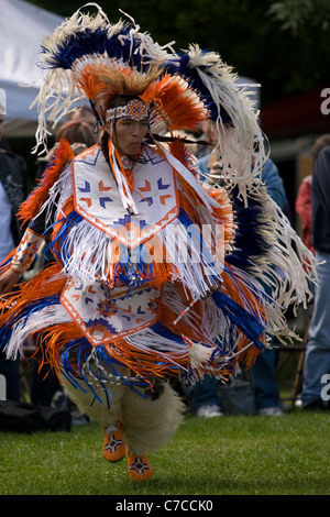 London, Canada - September 17, 2011: A First Nations Canadian wearing traditional clothing participates in a Pow Wow dance durin Stock Photo