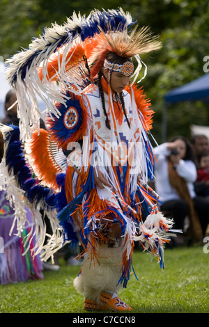 London, Canada - September 17, 2011: A First Nations Canadian wearing traditional clothing participates in a Pow Wow dance durin Stock Photo