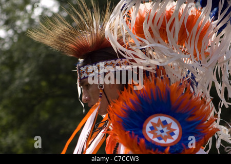 London, Canada - September 17, 2011: A First Nations Canadian wearing traditional clothing participates in a Pow Wow dance durin Stock Photo