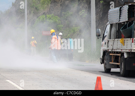 Men working on the Panamerican Highway, Panama. Stock Photo