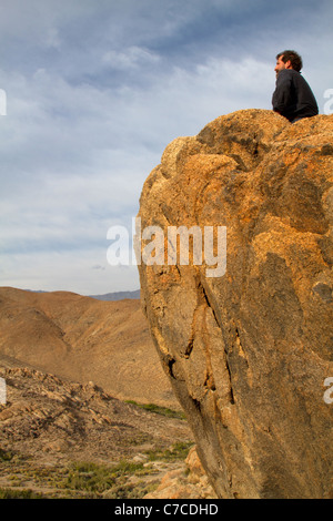 Man looking out over the vast landscape of the Alabama Hills near Lone Pine, California, USA Stock Photo