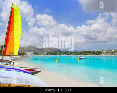 Beach of Puerto de Alcudia in Mallorca with hobie cat and kayak on Balearic Islands Spain Stock Photo