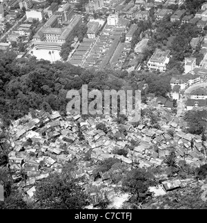 Historical picture from Brazil, 1950s.  Aerial view of capital Rio showing 'favelas', the shanty town above the city. Stock Photo