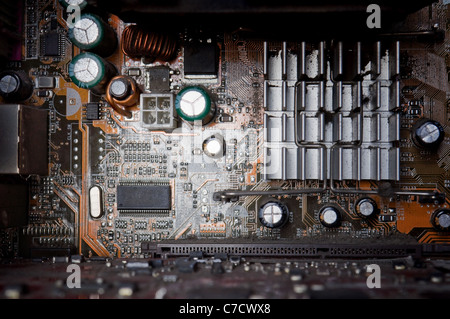 background of old electronic circuit boards in dark colors Stock Photo