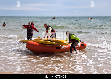 Members of the RNLI surf rescue squads Bournemouth beach England UK Stock Photo