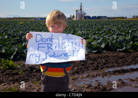 Young boy with ' Don't Frack my Future sign' at Camp Frack Protest Encampment & March against Hydraulic Water Fracturing & Shale-gas production at Becconsall, Banks, Southport, Europe, EU Stock Photo