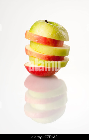Sliced Red and Green Apple on White Background Stock Photo