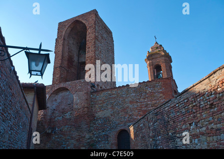 Exterior image of an ancient bell tower building in the medieval walled Umbrian town of Citta della Pieve, Italy. Stock Photo