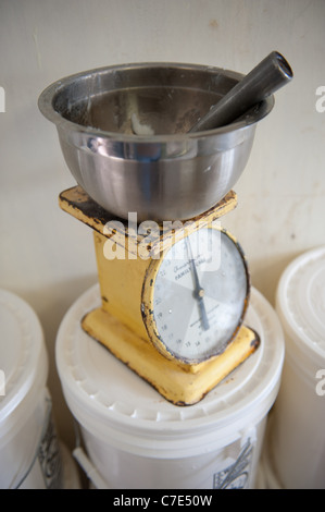 old fashioned scale and batter bowl for the process of making beaten biscuits Stock Photo