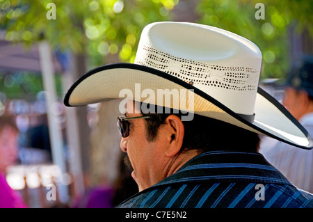 A Mexican man wearing a cowboy hat and 