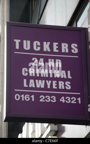 Sign above Tuckers 24hr criminal lawyers shop/offices in Manchester, UK. Stock Photo