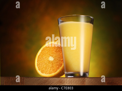 Glass of orange juice on a wooden board. Stock Photo