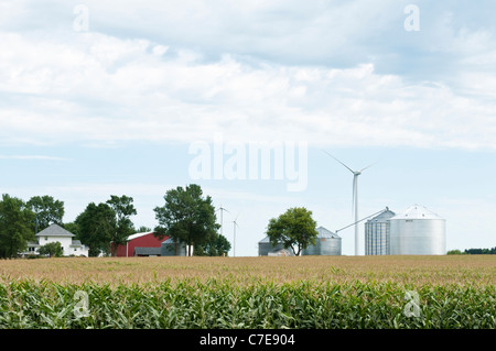 Horizontal-axis wind turbines are shown near a farm in Lakefield, Minnesota. Stock Photo