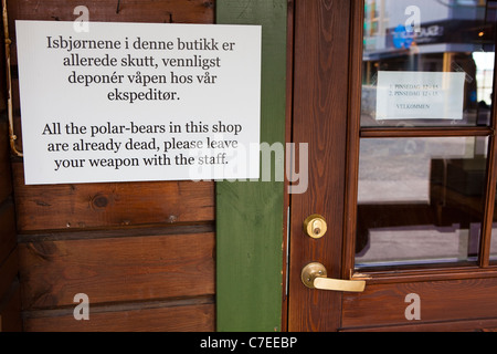 Polar bear and gun warning sign in Longyearbyen, Svalbard. Stock Photo