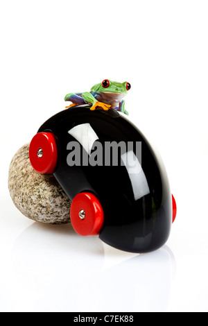 Car toy and crazy frog Stock Photo