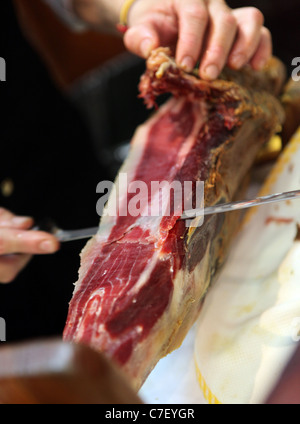 Tapas Trail in Jerez Spain. Pictured is traditional tapas eating in Seville. Pictured is Iberico Jamon (ham) Stock Photo