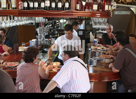 Tapas Trail in Jerez Spain with food writer Elizabeth Luard. Pictured is traditional tapas eating in Seville. Stock Photo