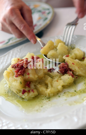 Tapas Trail in Jerez  Spain. Pictured is food at Restaurant Mesa Redonda in Jerez. Pictured is Potato with Jamon. Stock Photo