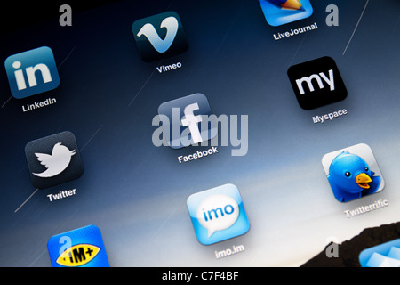 Apple iPad 2 screen showing social apps, including Facebook, Myspace, Twitter, LinkedIn, Vimeo, LiveJournal and Twitter. Stock Photo