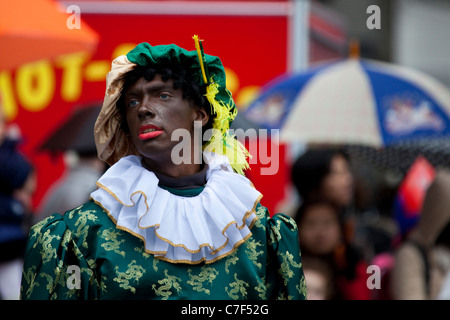 Participant dressed as Black Peter at Sinterklaas parade, Amsterdam Sinterklaas parade, Dam Square, Amsterdam, 14th November 201 Stock Photo