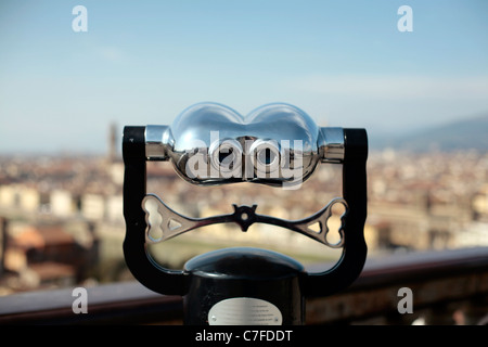 Coin operated telescope looking out over the city of Florence, Italy. Stock Photo