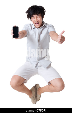 Young Man Jumping With a Mobile Phone Stock Photo