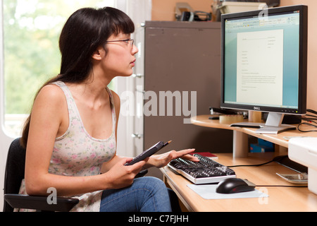 a man holds up a calculator upside down, with the words boobies