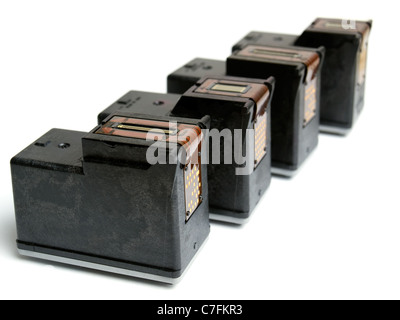 Empty ink cartridges sorted on a white background. Stock Photo