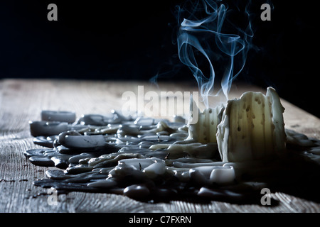 Blue smoke with candls on wooden shelf Stock Photo