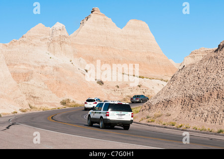 A Park Ranger drives through Badlands National Park in South Dakota. Stock Photo