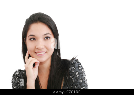 a young, pretty woman looks thoughtfully up - space for text Stock Photo