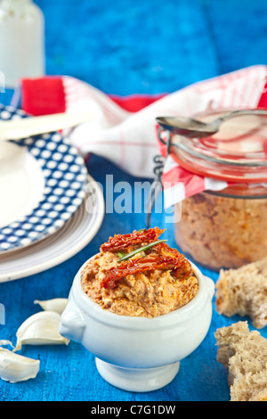 Mediterranean cheese spread made from cream cheese, feta cheese, artichokes and sun-dried tomatoes and herbs Stock Photo