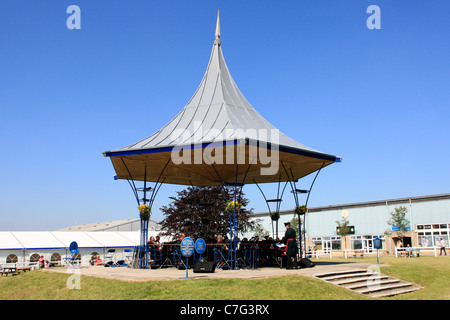 Musicians of the Light Infantry play in the bandstand at the Bath and West Showground in Somerset Stock Photo