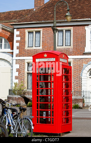 Inside Salisbury Cathedral close with an old fashioned telephone box in situ. Salisbury England UK Stock Photo