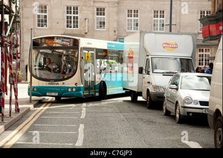 An Arriva wales bus unable to turn a corner because of a badly parked delivery van Aberystwyth UK Stock Photo