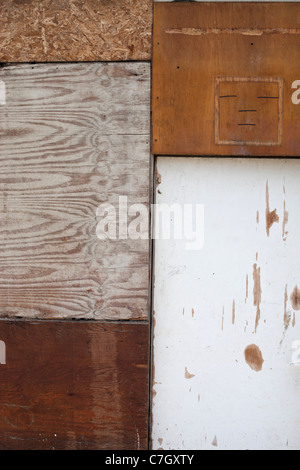 Five different pieces of wood used to board up a structure Stock Photo