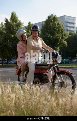 Senior couple happy on motorbike Stock Photo