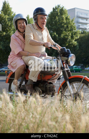 Senior couple happy on motorbike Stock Photo