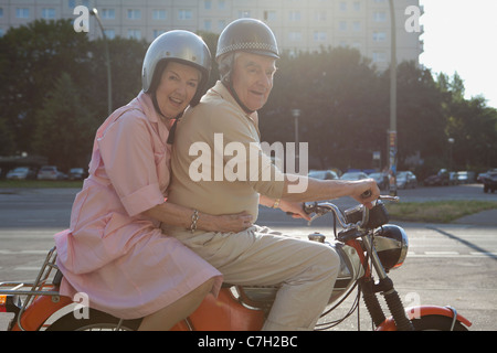 Senior couple happy on motorbike Stock Photo