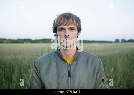 Profile of man standing in field Stock Photo