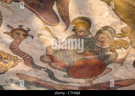 Medusa, part of Labours of Hercules mosaic in Triclinium, dining room, Villa Romana del Casale, Piazza Armerina, Sicily, Italy Stock Photo