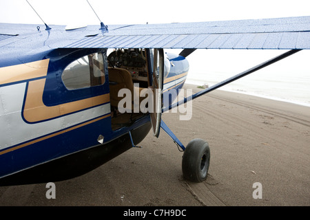 Prop plane parked on a sandy beach, Lake Clark National Park near Silver Salmon Creek Lodge, Alaska, United States of America Stock Photo