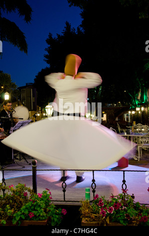 Turkey, Istanbul. Whirling dervish in traditional long robe and hat. Stock Photo