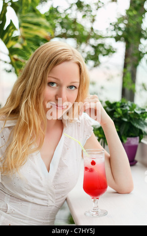 beautiful girl with cocktail glass in cafe Stock Photo